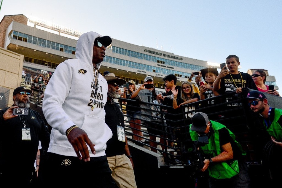 Jay Norvell pokes at Deion Sanders for wearing hat, sunglasses