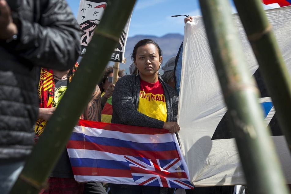 Activists gather to protest the construction of a massive telescope on the sacred mountain of Mauna Kea in July 2019.