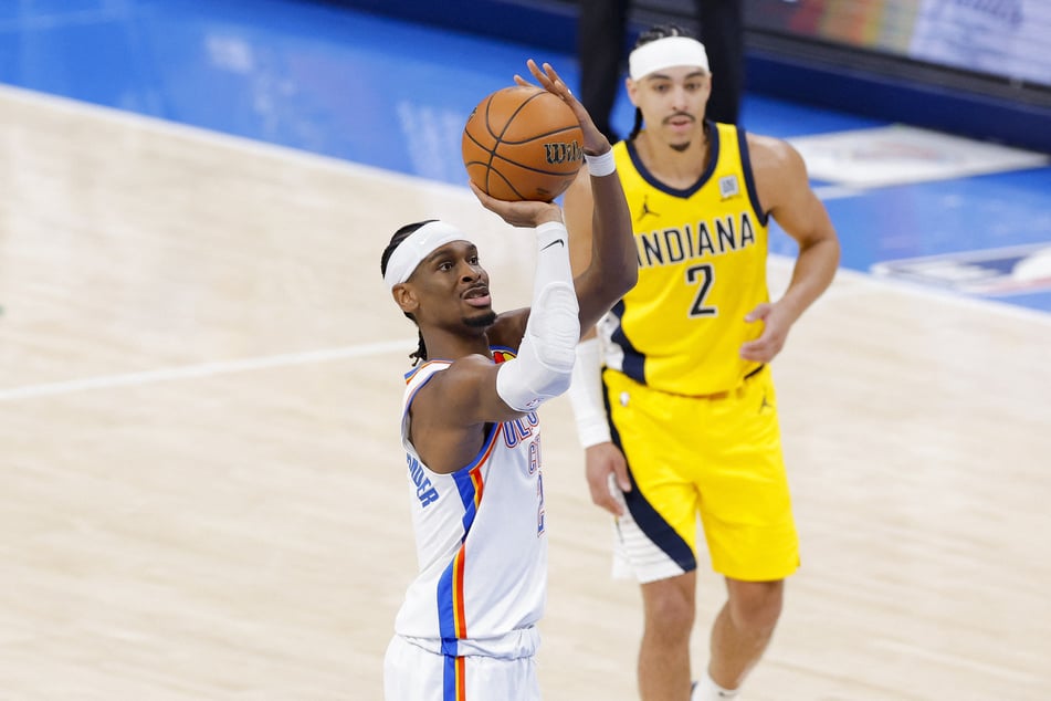 Oklahoma City Thunder guard Shai Gilgeous-Alexander makes a free throw as Indiana Pacers guard Andrew Nembhard looks on during Game 1 of the 2025 NBA Finals.