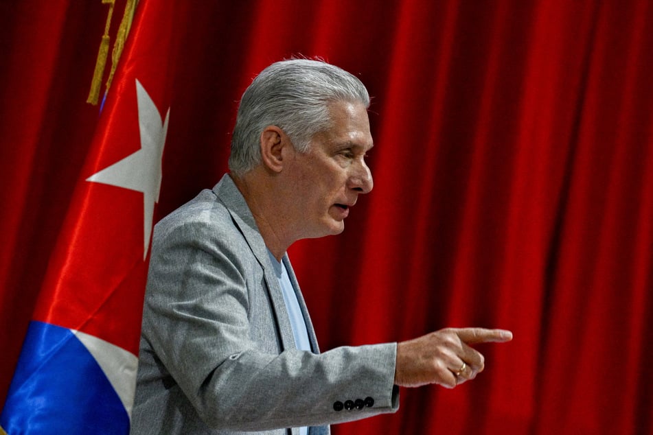 Cuba's President Miguel Diaz-Canel speaks during a meeting with members of the Nuestra America Convoy which arrived to the island with humanitarian aid at the Palacio de Convenciones in Havana on March 20, 2026.
