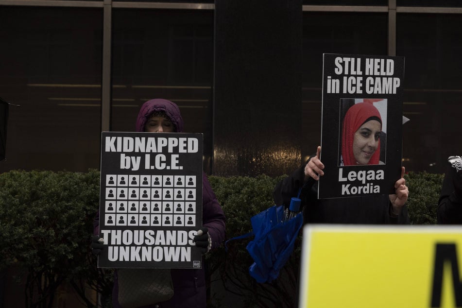 Demonstrators hold signs calling for Leqaa Kordia's release at an anti-ICE vigil outside of 26 Federal Plaza in New York City on December 29, 2025.