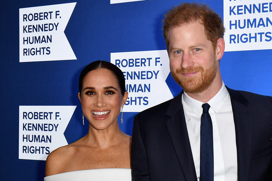 Prince Harry (r) will travel to London for his father's coronation without his wife Meghan Markle.