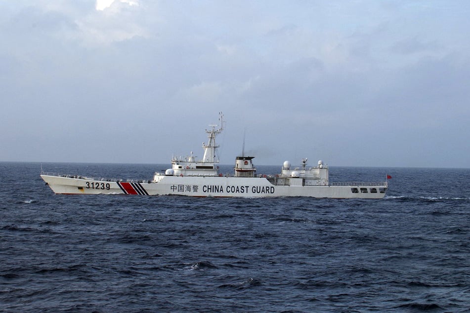 This handout picture taken and released by the Japan Coast Guard on December 22, 2015 shows a Chinese Coast Guard ship near disputed islets, known as the Senkaku islands in Japan and Diaoyu islands in China, in the East China Sea.