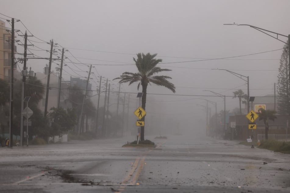 Hurricane Helene hit Georgia, where at least two people were killed in a tornado, before weakening into a tropical storm.