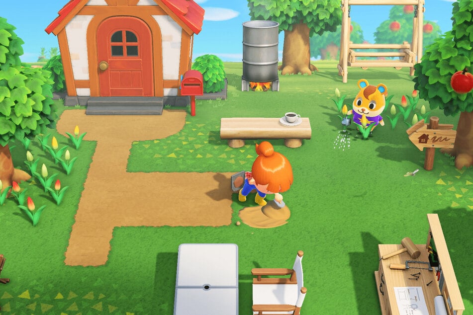 A player maintaining their garden in Animal Crossing: New Horizons.