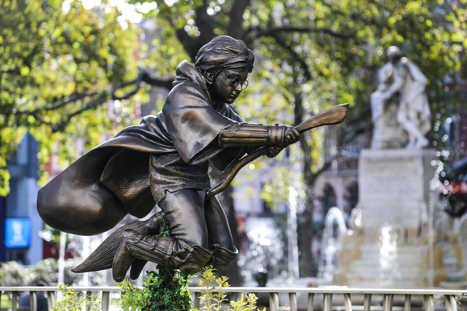 A Harry Potter Quidditch statue stands in Leicester Square, London, joining an illustrious trail of timeless movie characters from the past 100 years in Scenes on the Square.
