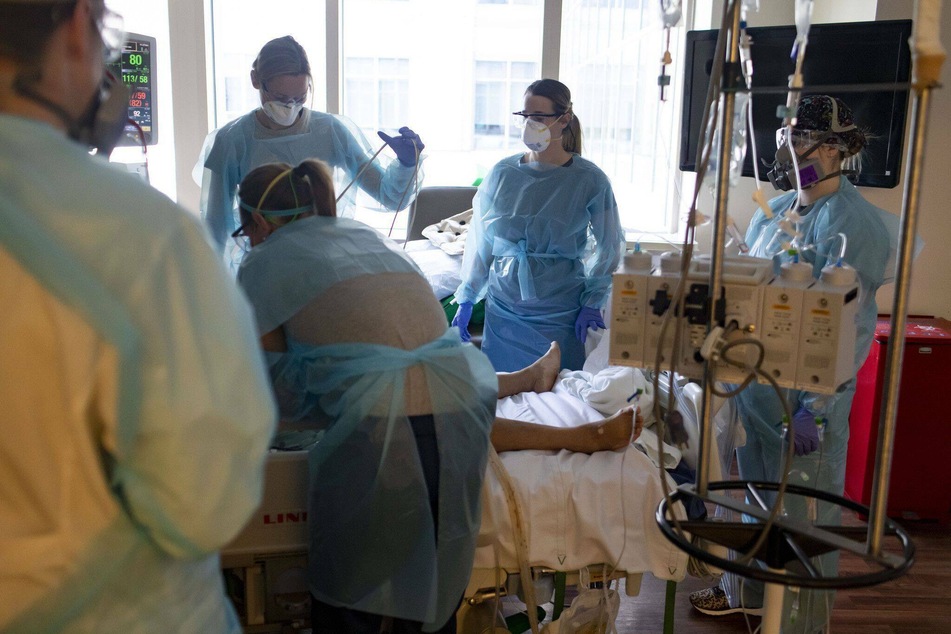 Doctors treat a Covid-19 patient in the ICU November 2020, at Northwestern Memorial Hospital in Chicago.