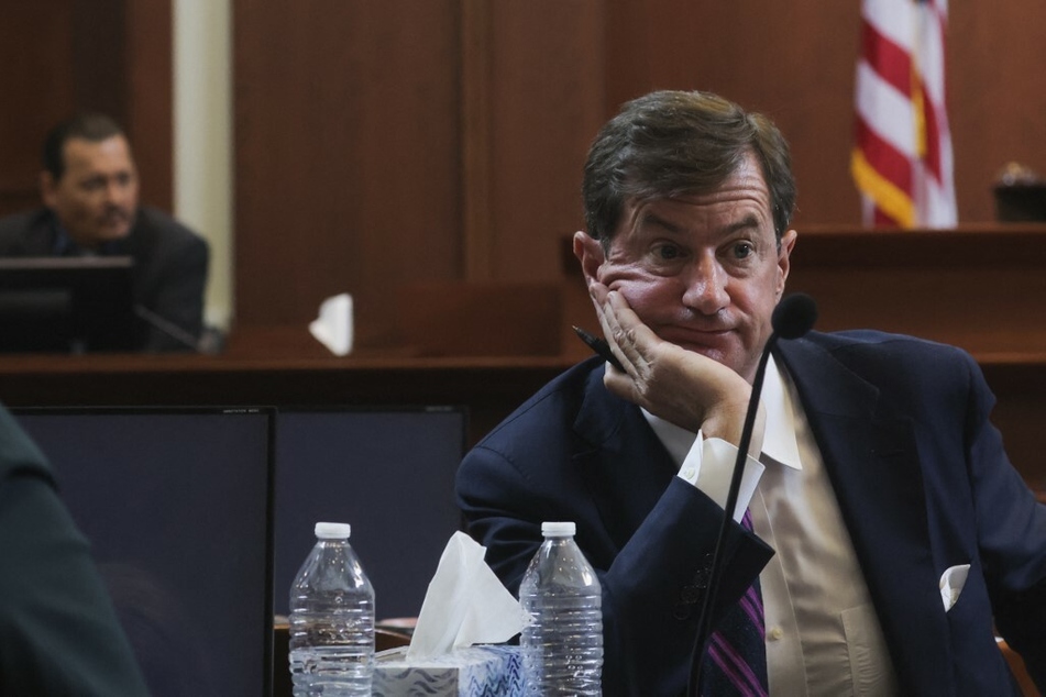 Johnny Depp's attorney Benjamin Chew listening to Depp's testimony on May 25, 2022.