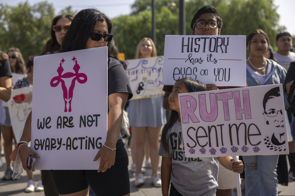 Protesters take part in the Women's March Action Rally for Reproductive Rights at Mariachi Plaza in Los Angeles, California, on October 8, 2022.