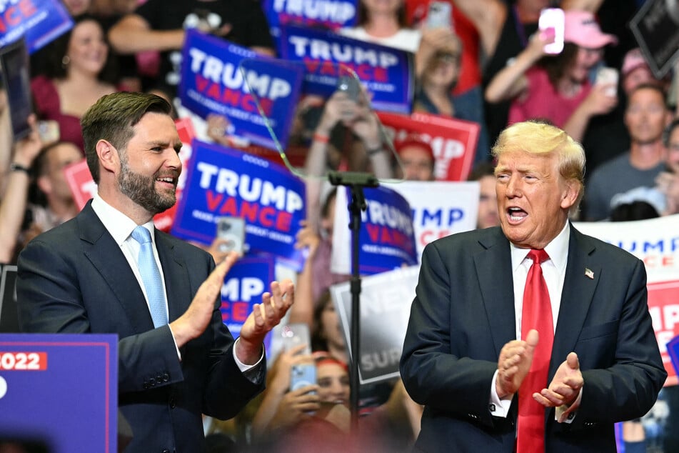 Donald Trump (r.) with running mate JD Vance (l.) during their first campaign rally together at Van Andel Arena in Grand Rapids, Michigan, on July 20, 2024.