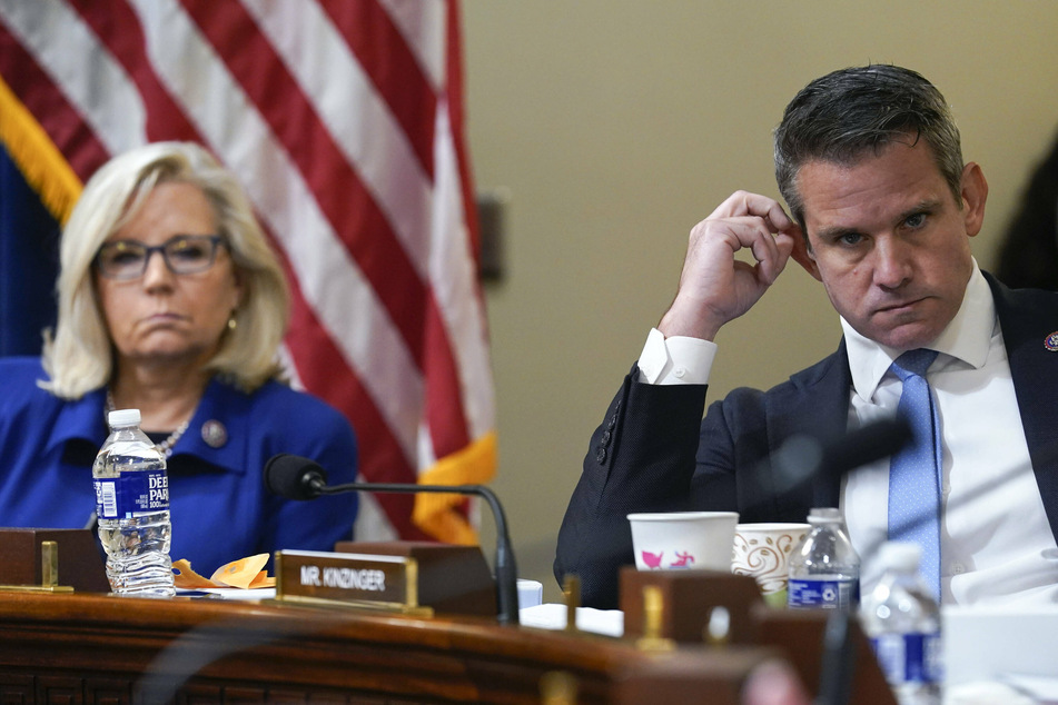 Reps. Adam Kinzinger (r.) and Liz Cheney listen to testimony about the January 6 attack.
