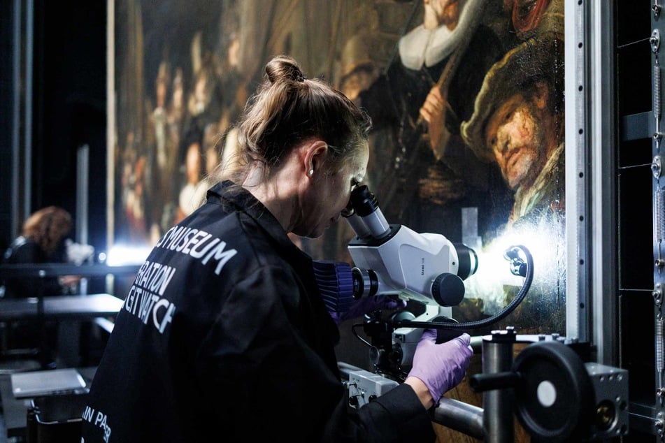 Removing old varnish from The Night Watch's surface is the third stage in a research and conservation project that started five years ago.