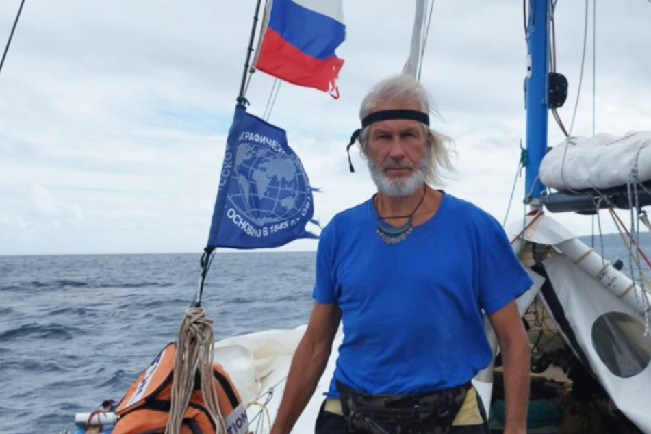 Evgeny Kovalevsky and two of his crew members had to be rescued from their boat after sharks attacked.