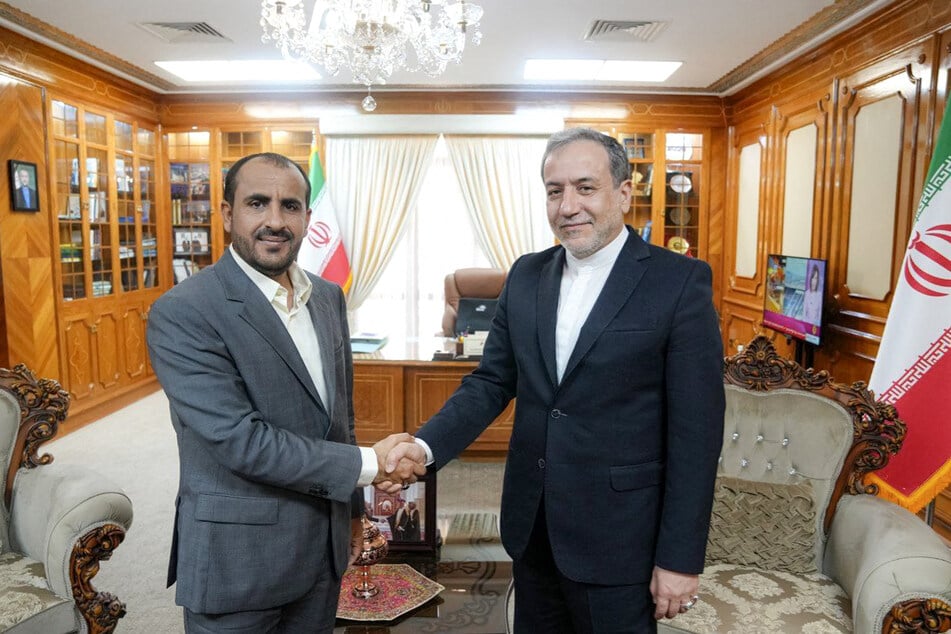 This handout picture provided by the Iranian foreign ministry shows Iran's Foreign Minister Abbas Araghchi (r.) meeting with spokesman and chief negotiator of Yemen's Houthis Mohammad Abdelsalam (l.) in Oman's capital Muscat on October 14, 2024.