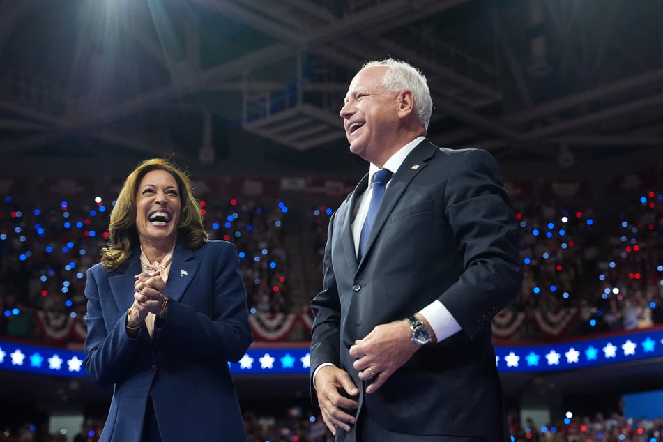 Vice President Kamala Harris (l.) and Democratic vice presidential candidate Minnesota Gov. Tim Walz (r.) appear on stage together during a campaign event at Girard College on Tuesday in Philadelphia, Pennsylvania.