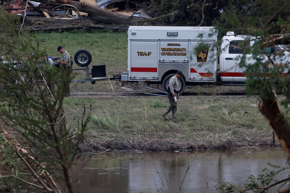 Members from Texas Game Wardens of the Law Enforcement Division work following flash flooding in Kerrville, Texas, on July 6, 2025.