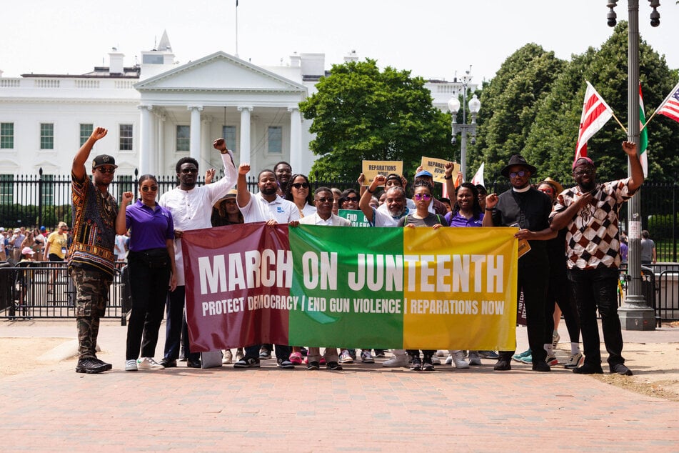 Racial justice advocates call for federal action on reparations in a Juneteenth rally outside the White House.