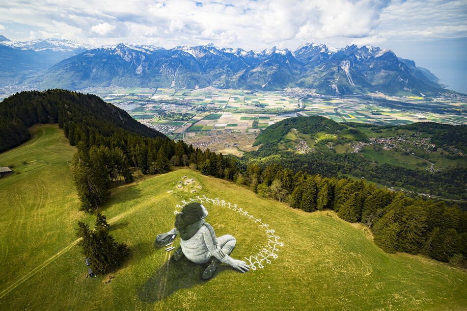 Nach der Coronavirus-Krise sollen alle Menschen gemeinsam in die gleiche Richtung blicken, sagt der Künstler mit diesem Bild.