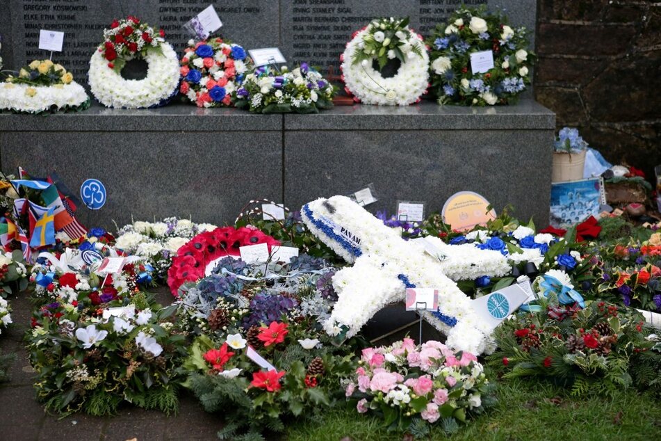 Floral tributes are pictured at a service to mark the 30th anniversary of the Lockerbie Air Disaster, the 1988 bombing of Pan Am flight 103, in Lockerbie, Scotland, on December 21, 2018.