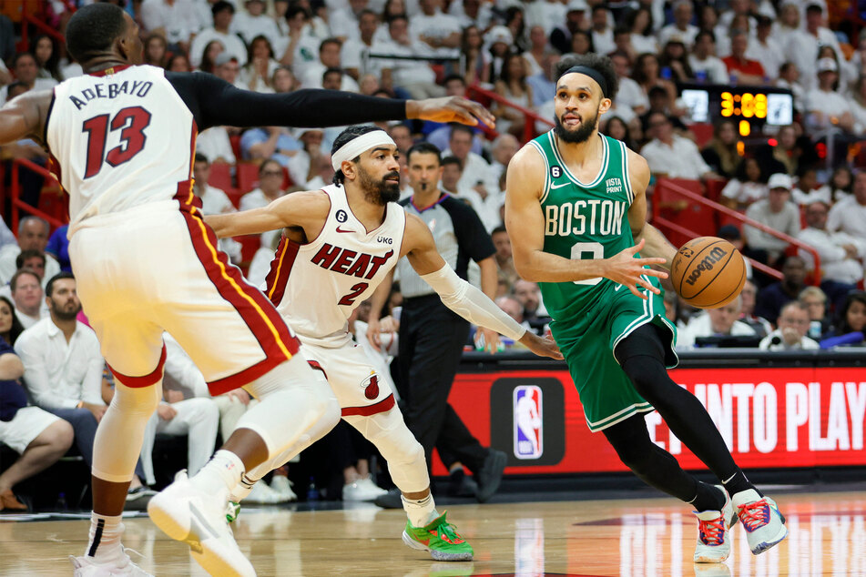 Boston Celtics guard Derrick White (r.) sunk an epic tip-in at the buzzer that clinched the game against the Miami Heat during Game 6 of the Eastern Conference Finals for the 2023 NBA playoffs on Saturday.