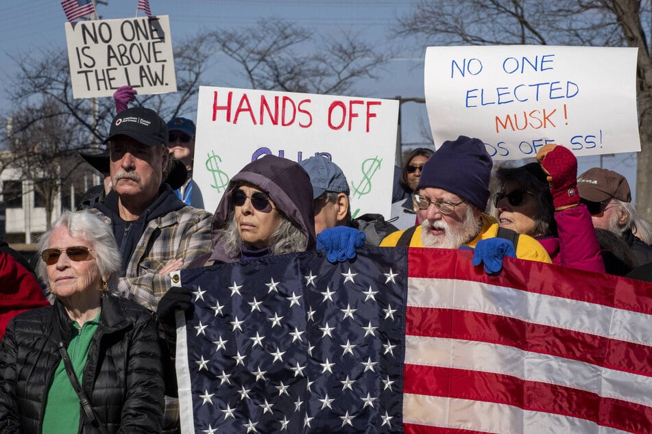 Maryland lawmakers and members of the public rally outside of the Social Security Administration headquarters in opposition to job cuts by Elon Musk's Department of Government Efficiency.