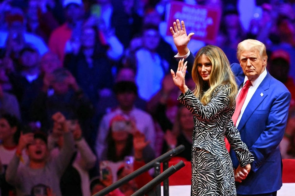 Donald Trump (r.) and his wife Melania Trump (l.) waving as they leave a campaign rally at Madison Square Garden in New York, New York on October 27, 2024.