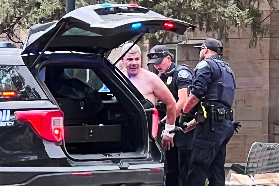Law enforcement officers detain a suspect after an attack that injured multiple people in Boulder, Colorado, on June 1, 2025.