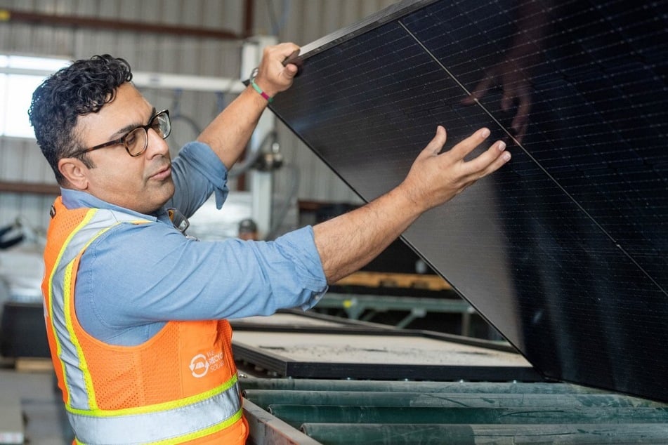 We Recycle Solar Chief Executive Officer Adam Saghei shows damaged solar panels to be recycled at his company's plant in Yuma, Arizona.
