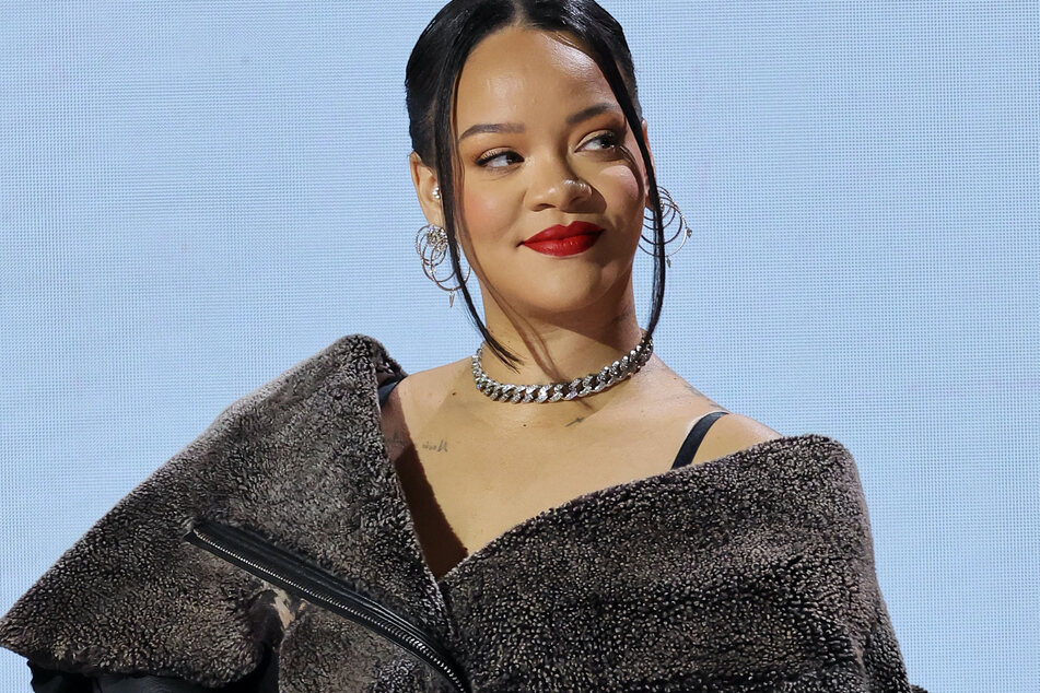 Rihanna's baby bump shines bright under faux fur crop top!