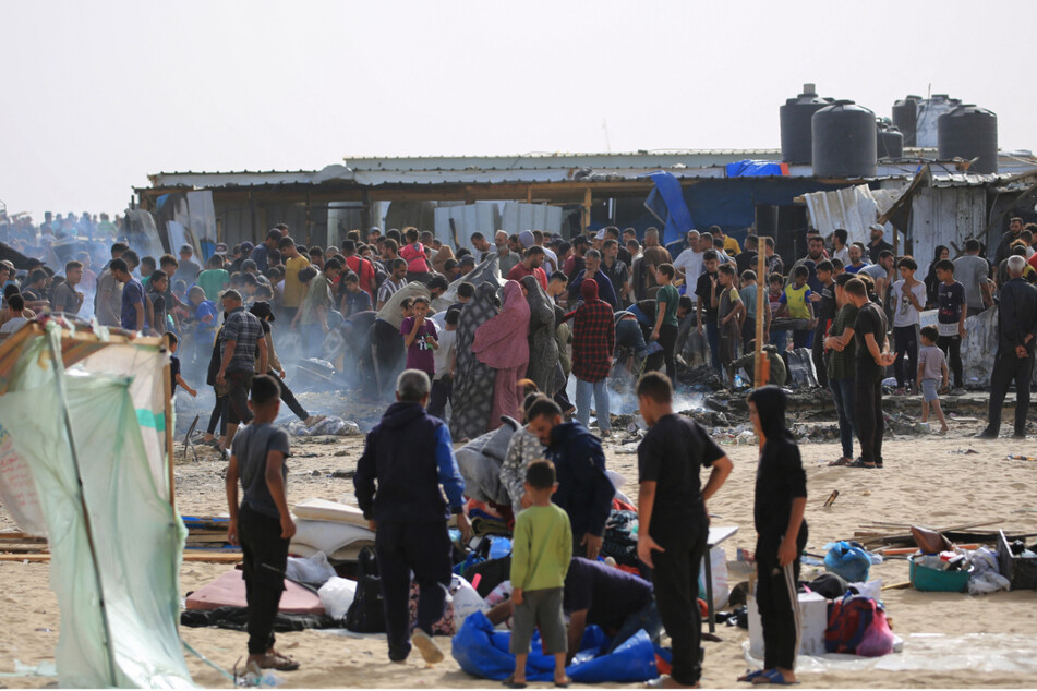 Palestinians gather at the site of an Israeli strike on a camp for internally displaced people in Rafah on May 27.