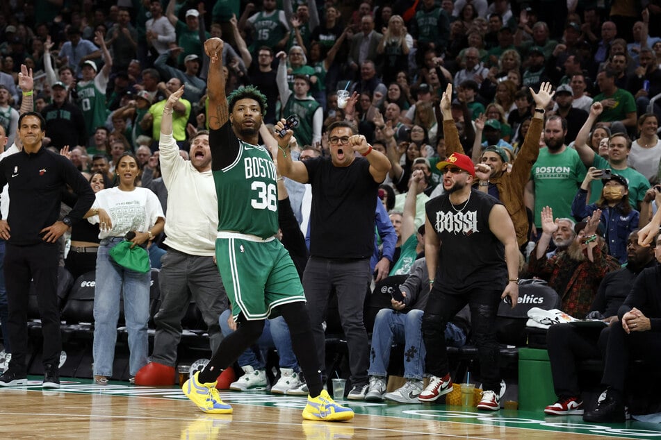 The Boston Celtics' Marcus Smart had 23 points in their 110-97 win over the Miami Heat.