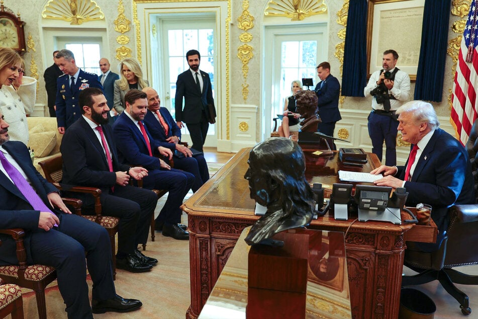 This handout photograph released by the official Syrian Arab News Agency (SANA) on Monday, shows President Donald Trump (far R) meeting with Syria's President Ahmed al-Sharaa (2nd L).