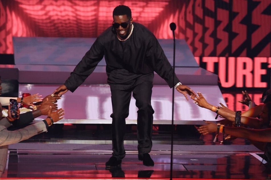 Diddy takes the stage to receive the Lifetime Achievement Award at the 2022 BET Awards.