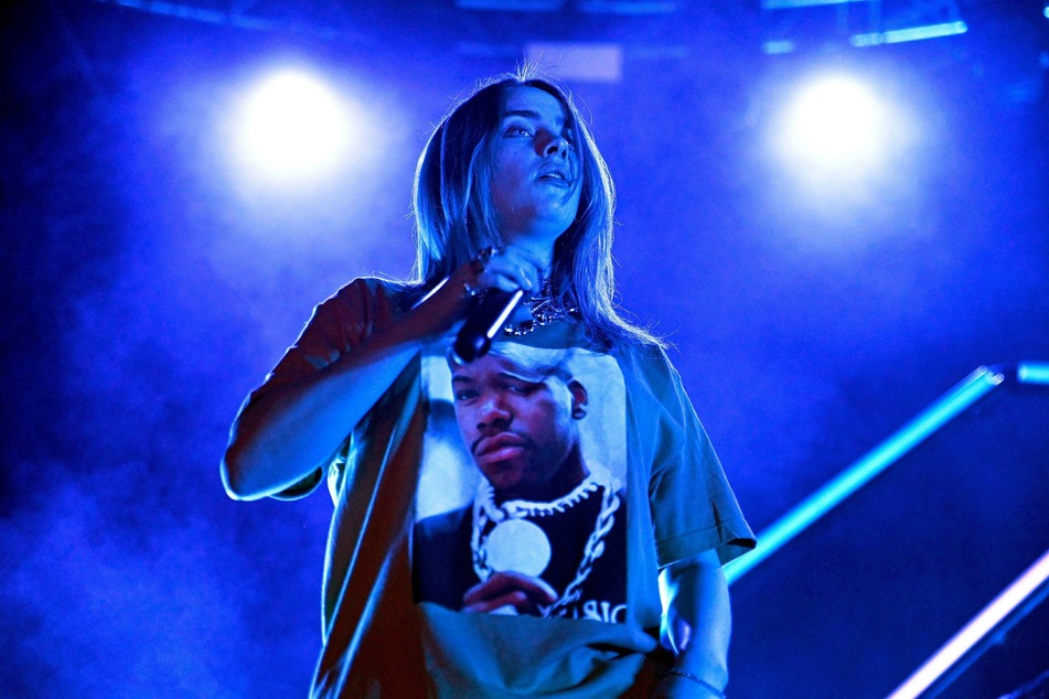 World star Billie Eilish performing on stage.