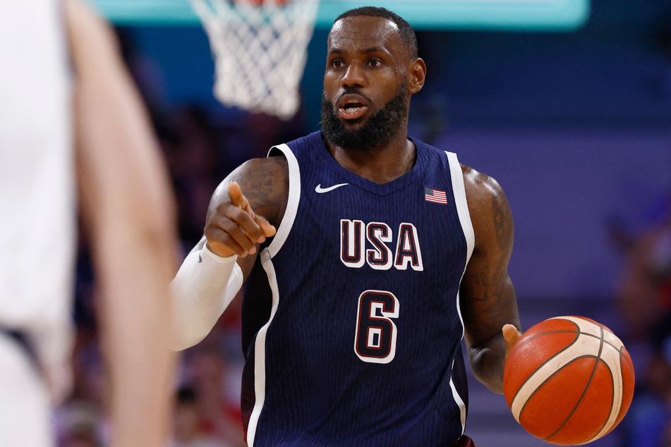 LeBron James scored 21 points as the US faced Serbia in their first match of the Paris Olympics.