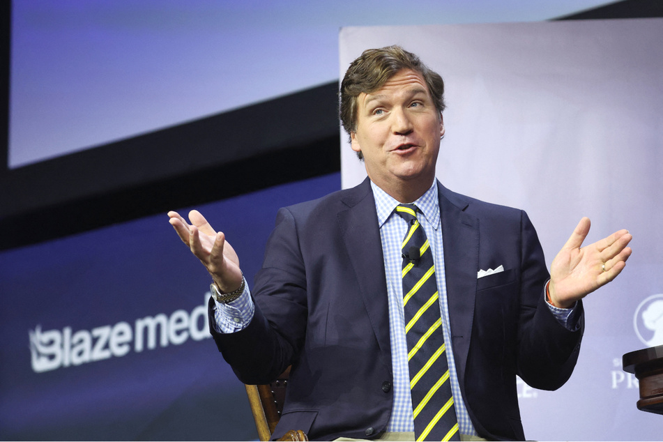 In an upcoming biography about former Fox News host Tucker Carlson, the media star claims he was let go from the network as part of a lawsuit settlement.