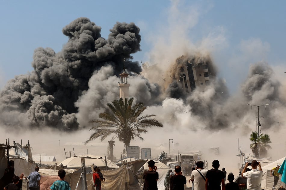 Smoke billows during Israeli strikes on the Mushtaha Tower in Gaza City on September 5, 2025.