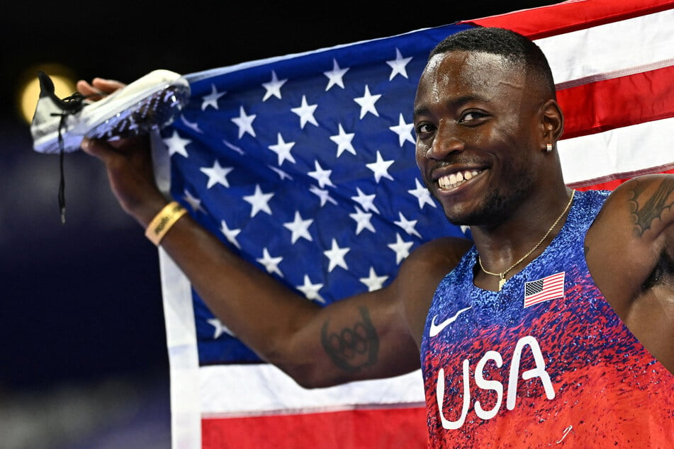 Grant Holloway of Team USA celebrates after winning gold in the men's 110m hurdles final at the Paris Olympics.