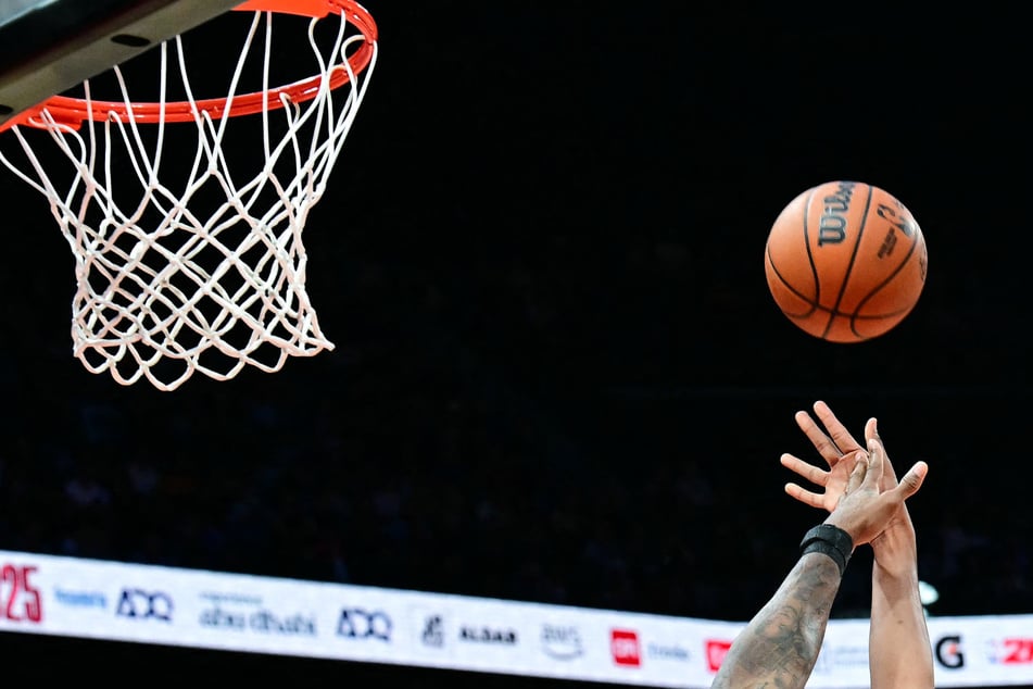 More than a dozen people have been charged with fixing US college and Chinese professional basketball games.