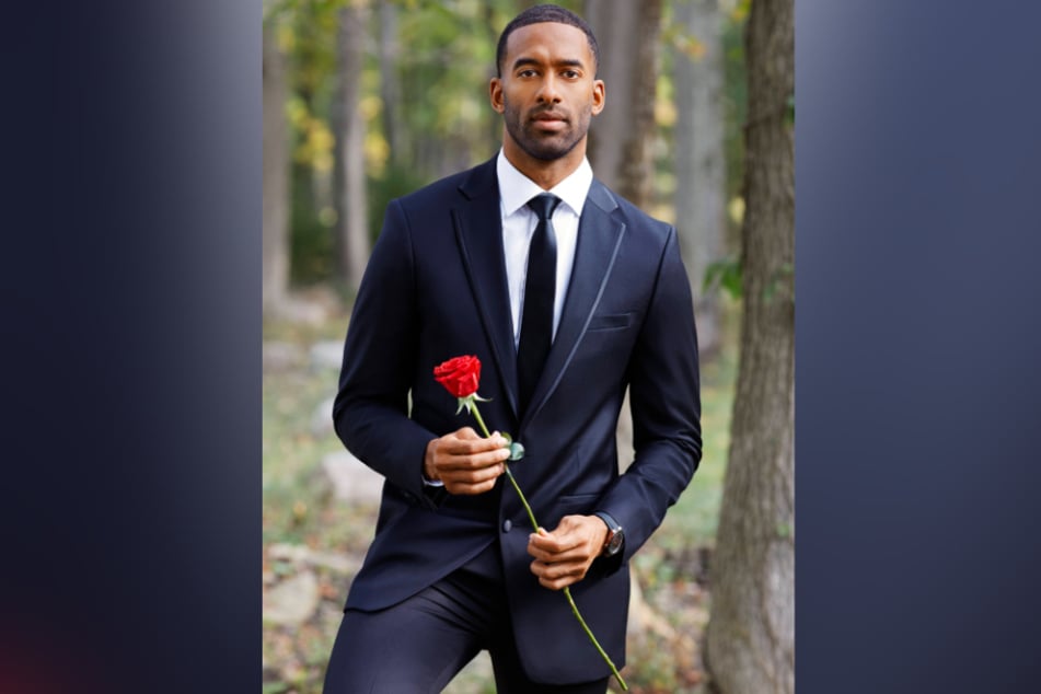 Photo of The Bachelor's Matt James holding a rose.