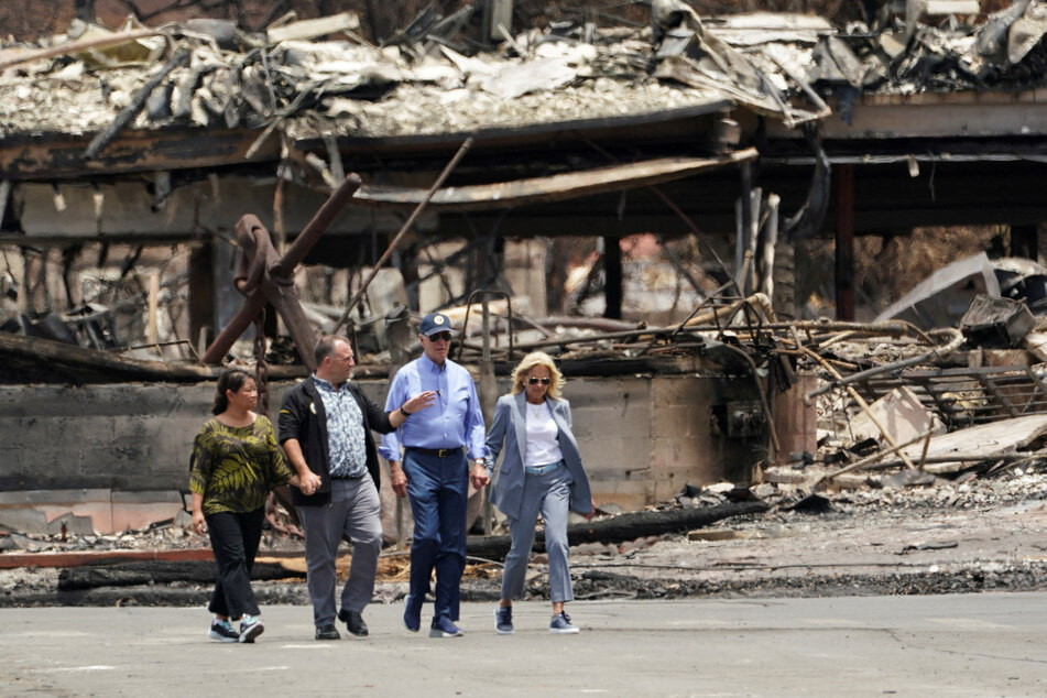 President Joe Biden and first lady Jill Biden walk with Hawaii Governor Josh Green and his wife Jaime Green to survey the damage in Lahaina.