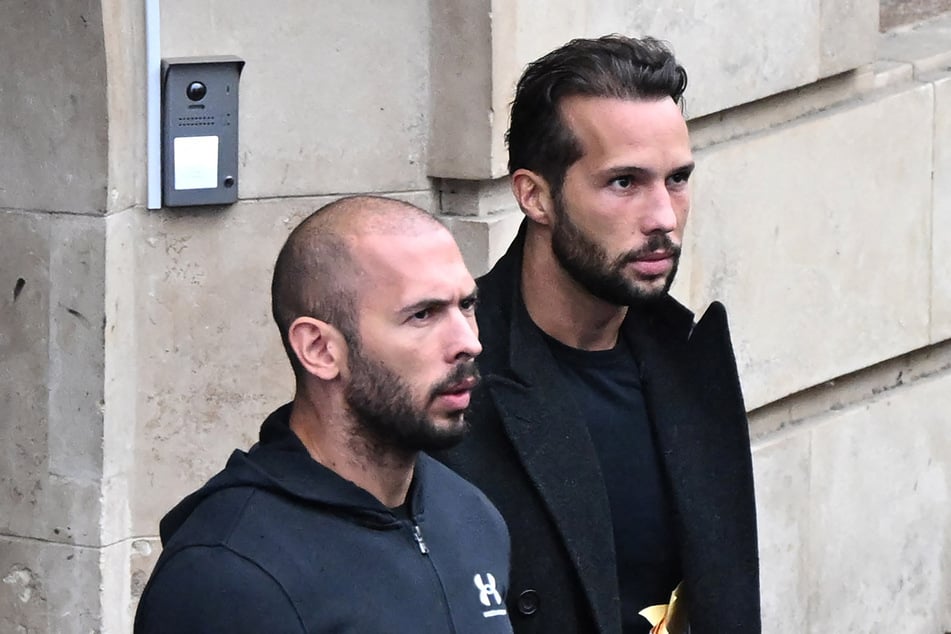 British-US former professional kickboxer and controversial influencer Andrew Tate (l.) and his brother Tristan Tate (r.) exit a court in Bucharest, Romania on January 10, 2023.