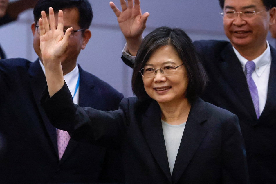 Taiwan's President Tsai Ing-wen waves near the boarding gate on the day of her departure to New York.