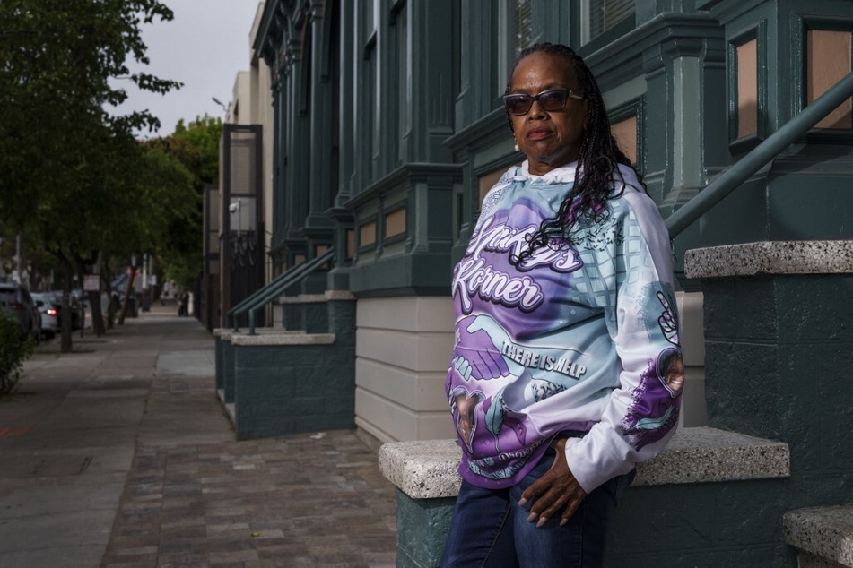 Lynette Mackey, a longtime resident of the Fillmore district, stands for a portrait outside the family home she and her family were evicted from in San Francisco, California, on June 27, 2023.