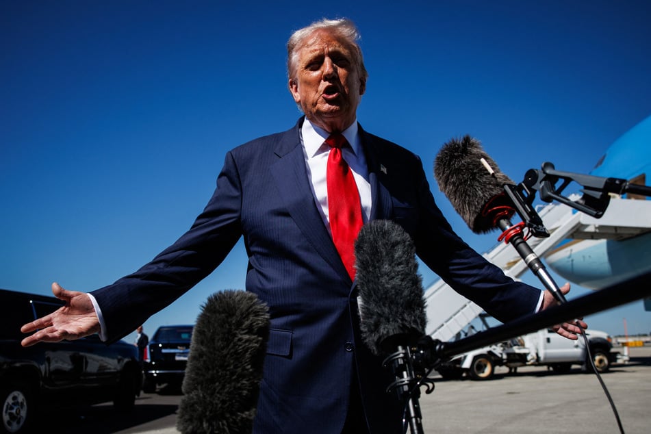 President Donald Trump speaks to reporters as he arrives at Palm Beach International Airport in Florida on October 31, 2025.