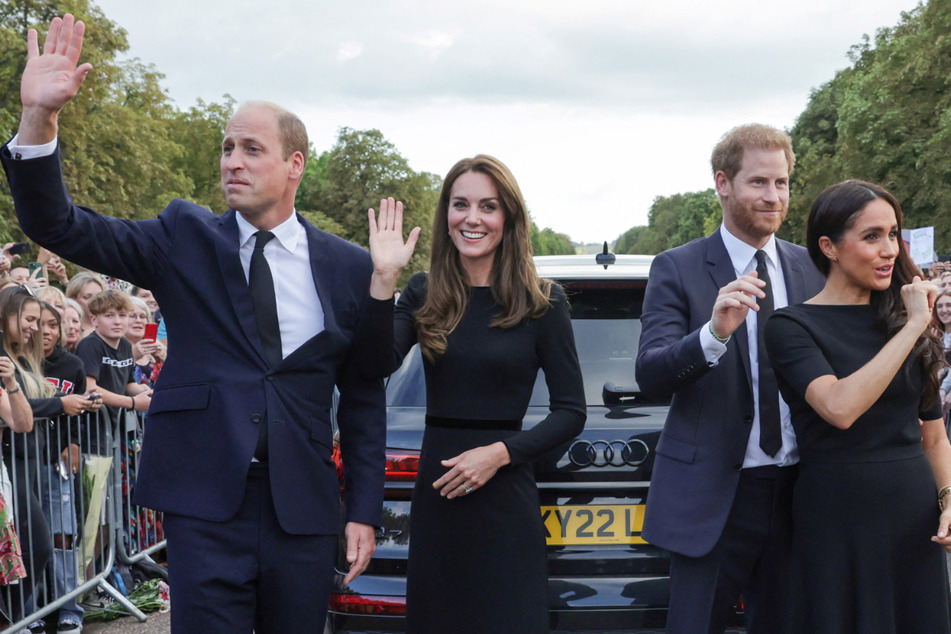 Prince Harry (second from r.) released a moving statement about his grandmother's death after appearing with his brother Prince William (l.), Catherine, Princess of Wales, and his wife Meghan Markle (r) to pay his respects and greet the public at Windsor Castle on Saturday.