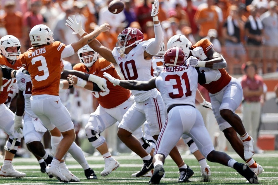 A weak performance from Texas quarterback starter Quinn Ewers (l) against Alabama could pressure coach Steve Sarkisian to possibly look elsewhere for a quarterback.