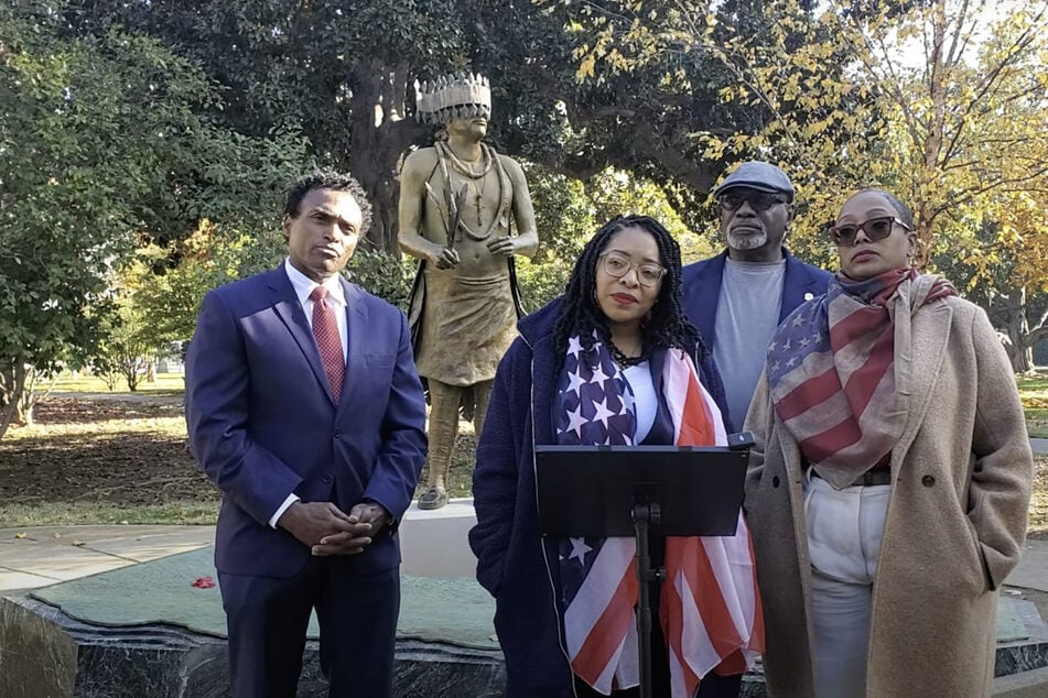 Reparations activists and advocates speak during a press conference outside the California State Capitol in Sacramento on December 2, 2024.