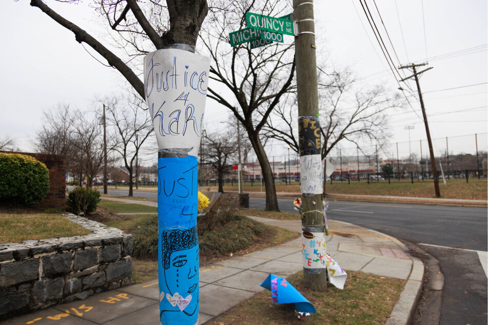 Memorials in remembrance of Karon Blake have been posted on Quincy Street at the site of his death in Washington DC after it was revealed a government employee fatally shot the 13-year old.