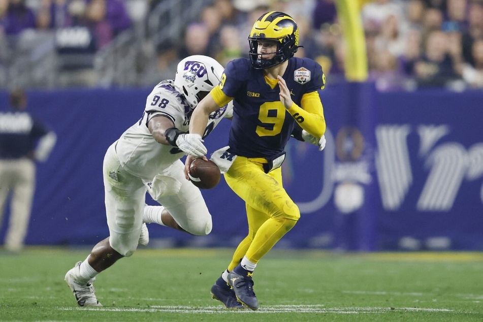 Michigan starting quarterback JJ McCarthy (r.) is still haunted by his January loss to the Horned Frogs.